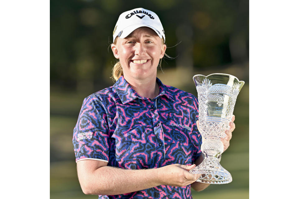 Gemma Dryburgh of Scotland holds the trophy after winning the LPGA Tour's Toto Japan Classic at the Seta Golf Club in Shiga, Japan, Sunday, Nov. 6, 2022. (Kyodo News via AP)