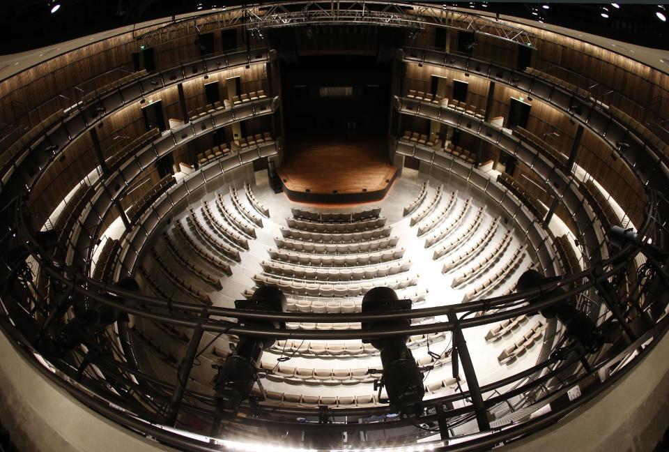In this April 10, 2014, photo, the circular CMA Theater is seen at the Country Music Hall of Fame and Museum in Nashville, Tenn. A $100 million expansion provides more interactive and contemporary exhibits as well as providing new meeting and performing space. (AP Photo/Mark Humphrey)