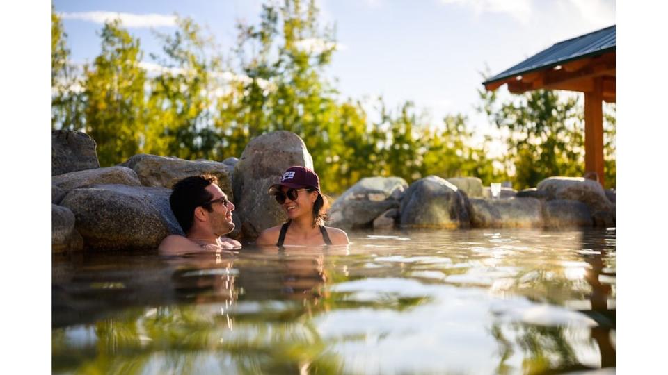 A couple soak in the Japanese onsen-inspired Eclipse Pool at Eclipse Nordic Hot Springs