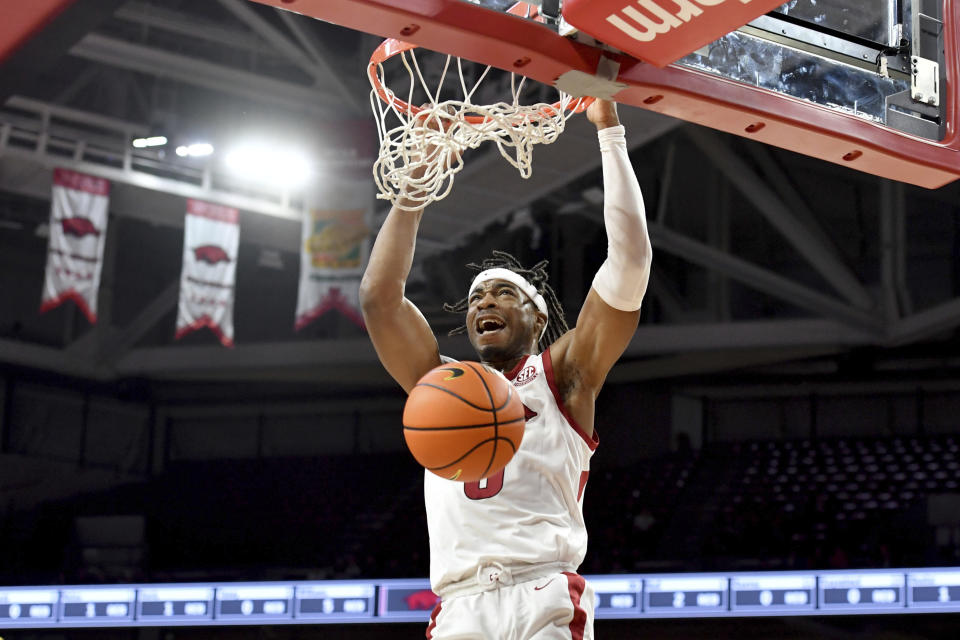 Arkansas guard Stanley Umude dunks on a fast break against Central Arkansas during the first half of an NCAA college basketball game Wednesday, Dec. 1, 2021, in Fayetteville, Ark. (AP Photo/Michael Woods)