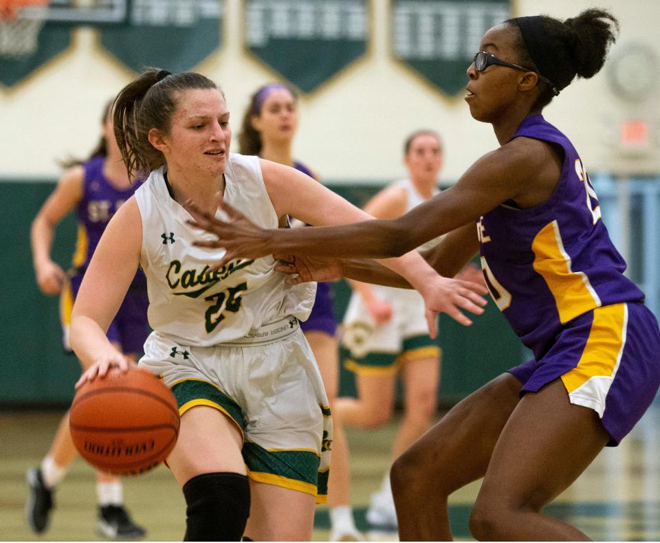 St. Rose at Red Bank Catholic basketball. RBC's Lucy Alberici drives past St. Rose's Layla Laws.    Red Bank, NJThursday, March 4, 2021  