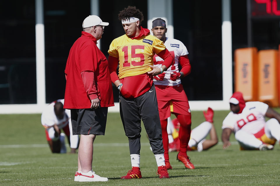 Kansas City Chiefs quarterback Patrick Mahomes (15) talks with head coach Andy Reid during practice on Wednesday. (AP Photo/Brynn Anderson)