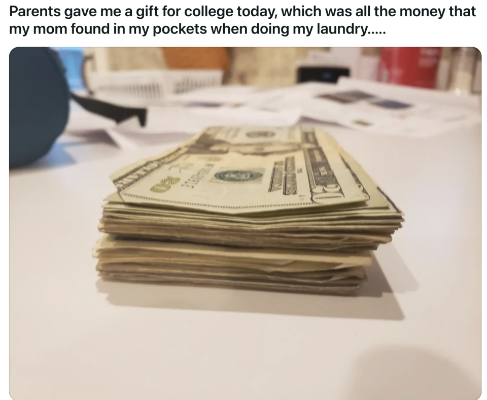 Stack of various bills on a table, presented as a gift from parents for college funds