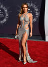 <p>This drool-worthy look ticks all of J.Lo’s trend boxes: sequins, leggy and barely-there. Is it possible the green Versace dress was a thing of fourteen years ago? [Photo: Getty] </p>