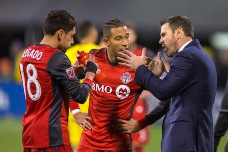 Nov 21, 2017; Columbus, OH, USA; Toronto FC head coach Greg Vanney talks to defender Justin Morrow (2) and midfielder Marky Delgado (18) during a play stoppage in the second half of the game against the Columbus Crew SC in the first leg of the MLS Eastern Conference Championship at MAPFRE Stadium. Trevor Ruszkowski-USA TODAY Sports