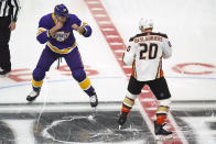 Los Angeles Kings defenseman Kurtis MacDermid (56) and Anaheim Ducks left wing Nicolas Deslauriers (20) square up for a fight during the first period of an NHL hockey game Tuesday, Feb. 2, 2021, in Los Angeles. (AP Photo/Ashley Landis)