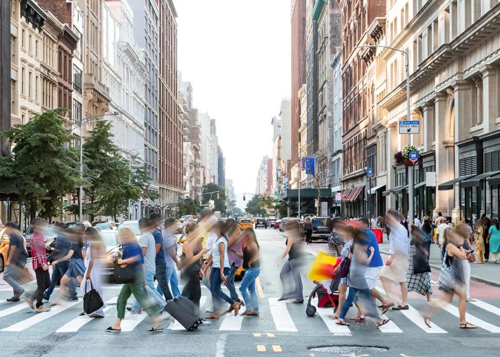 anonymous people walking in New York city street with motion blur, concept of average person