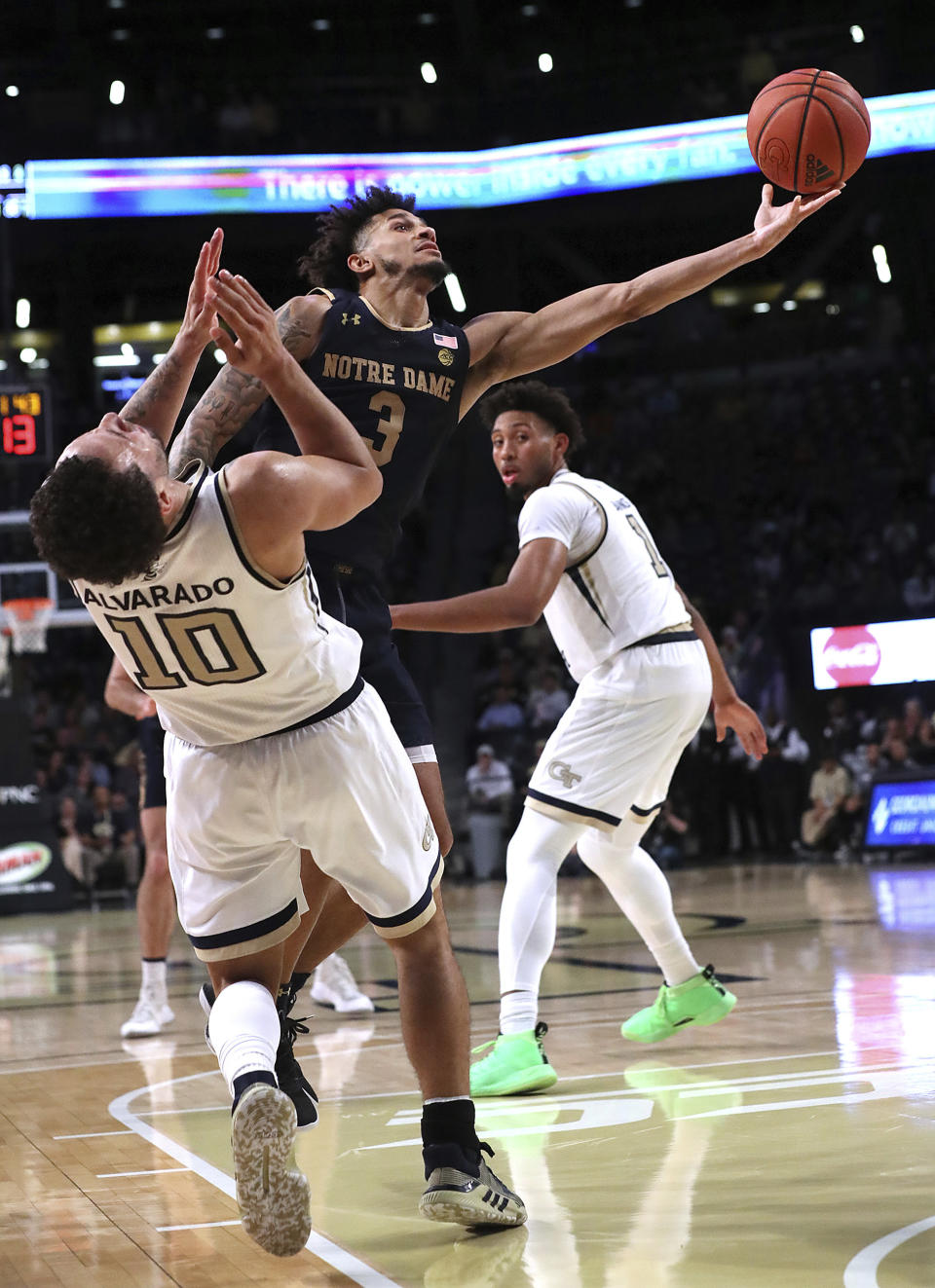 Notre Dame guard Prentiss Hubb knocks Georgia Tech guard Jose Alvarado to the hardwood on his way to the basket in the final minutes of an NCAA college basketball game Wednesday, Jan. 15, 2020, in Atlanta. (Curtis Compton/Atlanta Journal-Constitution via AP)