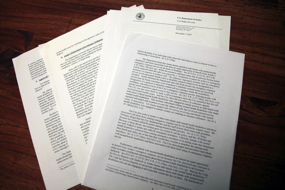 Pages from a Nov. 7, 2023, letter are shown from the U.S. Department of Justice to the Minneapolis suburb of Anoka, Minn., about its enforcement of an anti-crime ordinance that allows the city to penalize landlords if there are too many police or emergency calls to an address. The department has concluded that Anoka's enforcement of the ordinance discriminated against renters with mental health disabilities. Photo taken Feb. 2, 2024. (AP Photo/John Hanna)