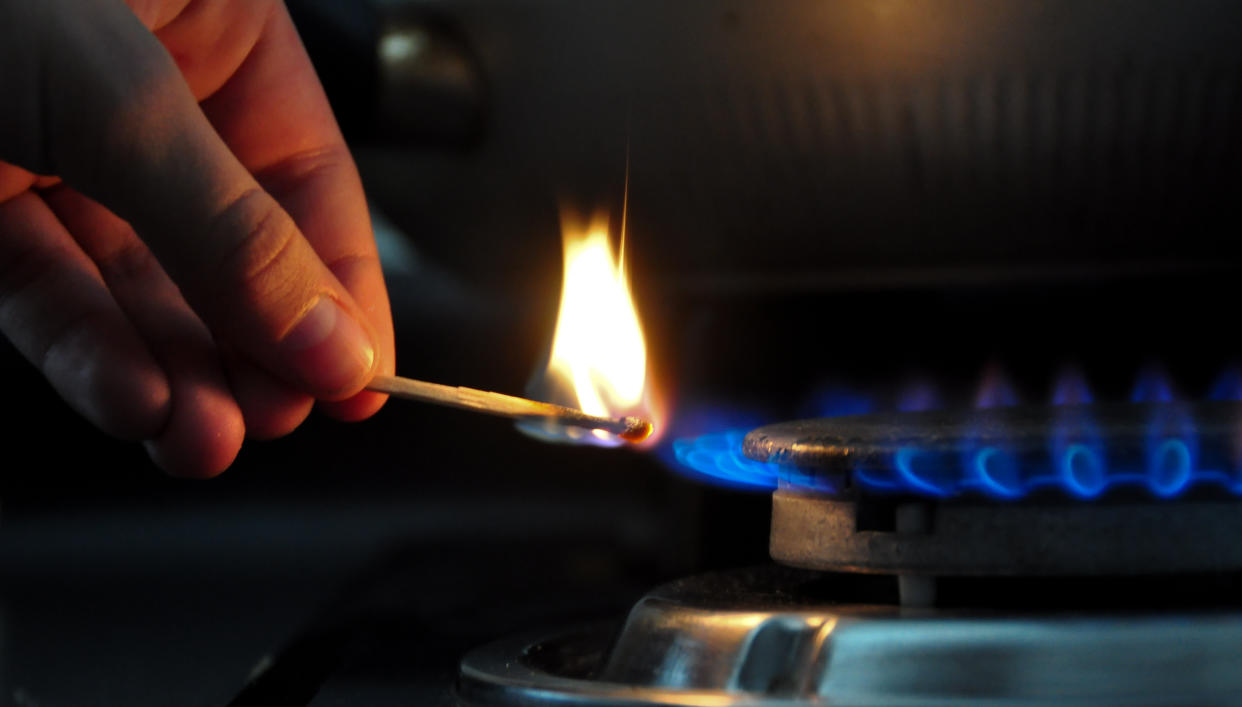 TO GO WITH AFP STORY BY MIGUEL SANCHEZ
Lighting a domestic gas hob in Santiago, Chile, October 192, 2012. Chile needs to increase the production of energy by 8,000 MW to ensure its growth, specially in the mining sector, but finding a way compatible with the environment. AFP PHOTO/Martin BERNETTI        (Photo credit should read MARTIN BERNETTI/AFP via Getty Images)