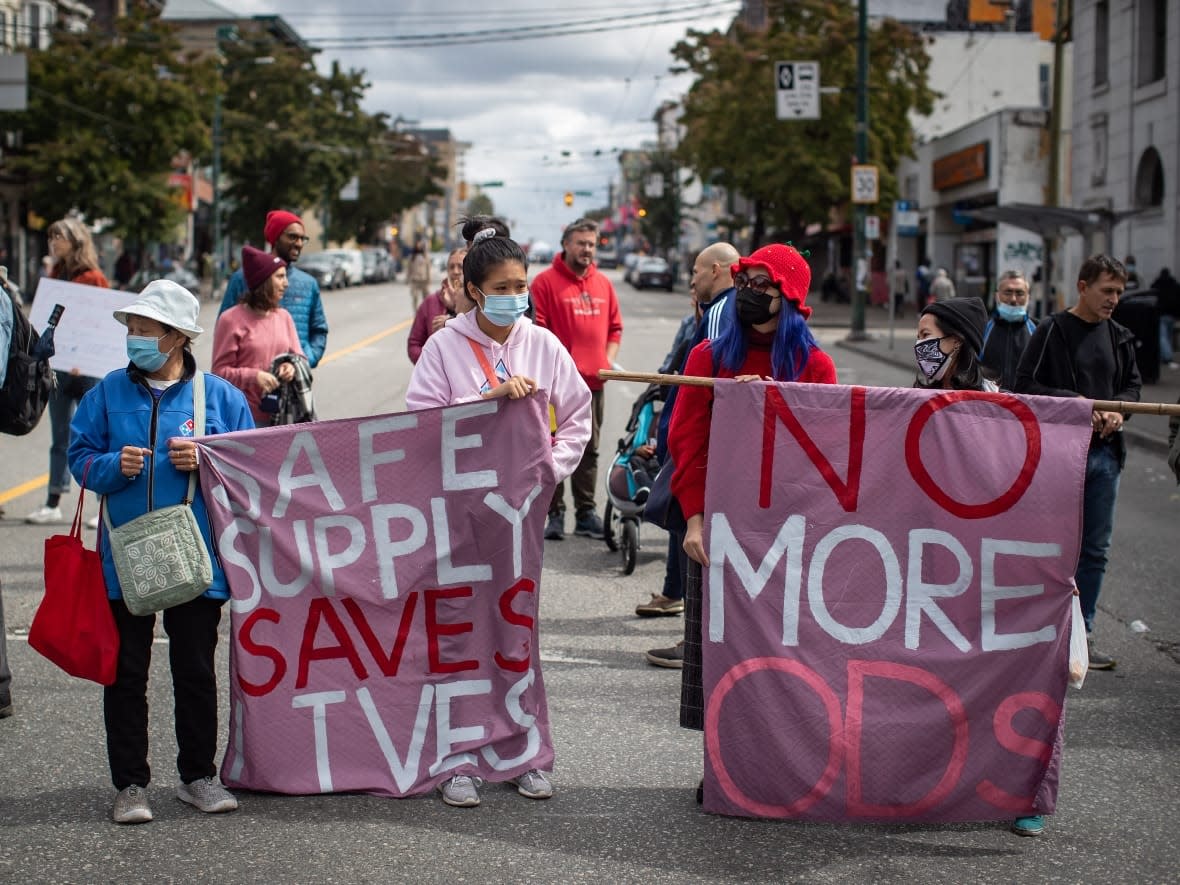 Protesters in Vancouver call for a safe supply of illegal drugs on International Overdose Awareness Day. (Darryl Dyck/The Canadian Press - image credit)