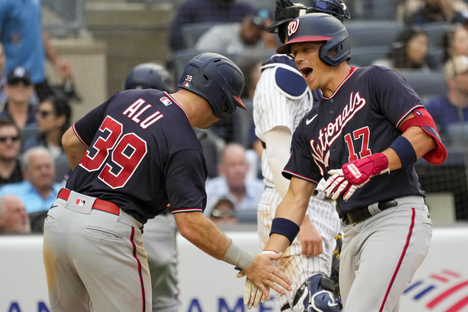 Washington Nationals' Alex Call (17) celebrates with Jake Alu (39) after they scored off of Call's two-run home run in the seventh inning of a baseball game against the New York Yankees, Thursday, Aug. 24, 2023, in New York. (AP Photo/Mary Altaffer)