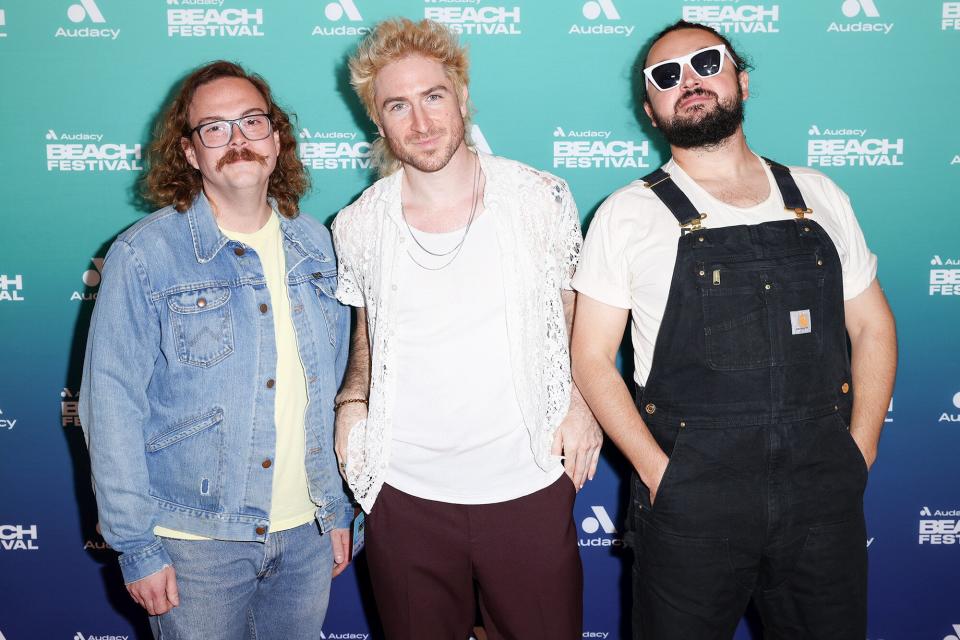 Sean Waugaman, Nicholas Petricca and Eli Maiman of the band Walk the Moon are seen at Audacy Beach Festival on December 5, 2021 in Fort Lauderdale, Florida.