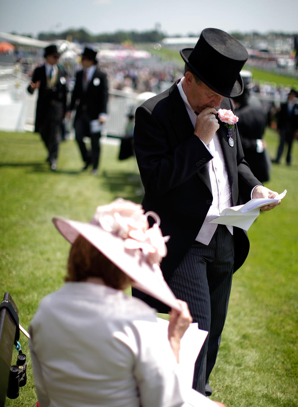 EPSOM, ENGLAND - JUNE 04: Racegoers attend the Epsom Downs racecourse on Derby Day on June 4, 2011 in Epsom, England. The Queen's horse Carlton Hall is the Bookmakers favourite to win the Derby. (Photo by Matthew Lloyd/Getty Images)