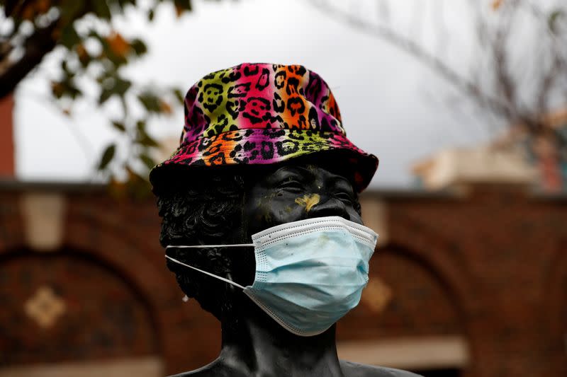 A bronze statue of late singer Ella Fitzgerald is seen wearing a hat and protective face mask, as the global outbreak of the coronavirus disease (COVID-19) continues in Yonkers, New York