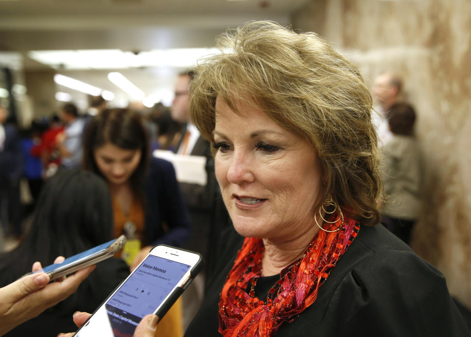 FILE - In this May 9, 2019, file photo, State Sen. Republican Leader Shannon Grove, of Bakersfield, talks to reporters about Gov. Gavin Newsom proposed 2019-2020 revised state budget in Sacramento, Calif. Republican state lawmakers say the liberal policies pushed by their colleagues are making California prohibitively expensive; millions of people live in poverty and inequality is stark. State Sen. Grove said California has become a leader on the wrong things, like homelessness and the cost of gasoline. (AP Photo/Rich Pedroncelli, File)