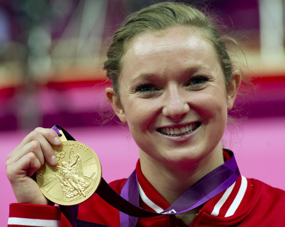 Canada's Rosannagh MacLennan, from King City, Ont., holds up her gold medal for the women's trampoline at the 2012 Olympic Games in London on Saturday, August 4, 2012. THE CANADIAN PRESS/Ryan Remiorz