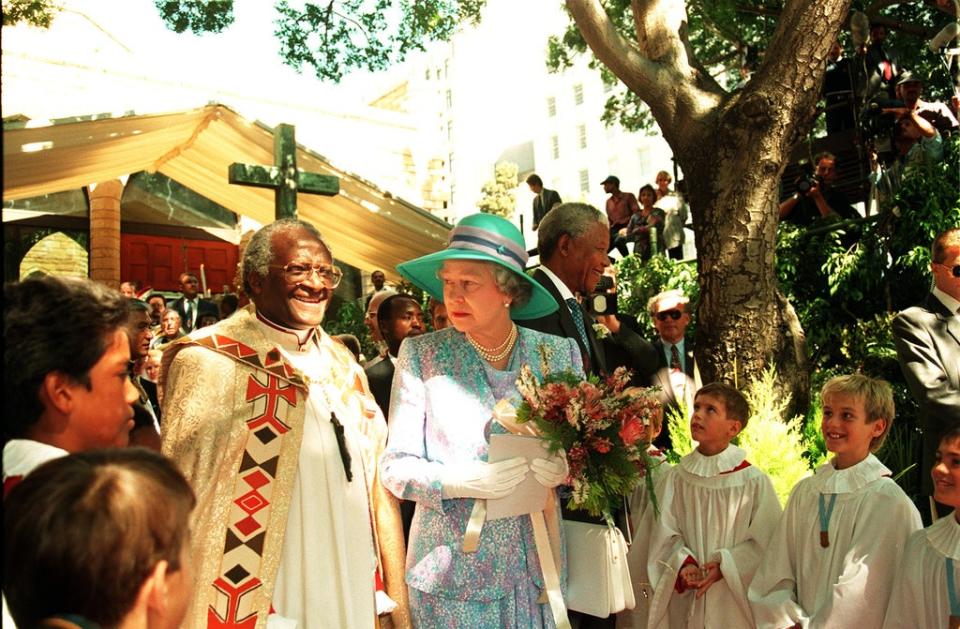 Archbishop Desmond Tutu with the Queen in Cape Town in 1995 (Martin Keene/PA)