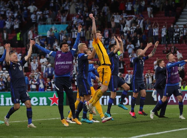 Finland players celebrate with their fans after victory over Denmark in the Euro 2020 match in Copenhagen