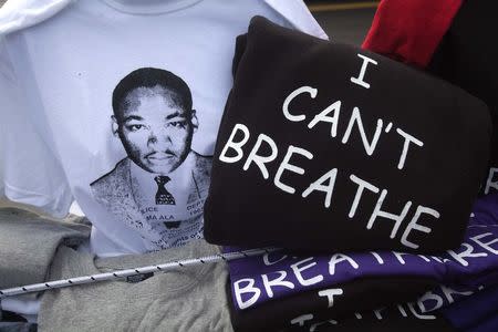 T-shirts with the image of Martin Luther King and with the words "I can't breathe" are pictured for sale during a Martin Luther King day rally in the Harlem section of New York January 19, 2015. REUTERS/Carlo Allegri