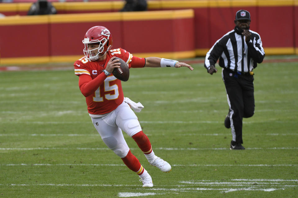 Kansas City Chiefs quarterback Patrick Mahomes scrambles up field during the first half of an NFL divisional round football game against the Cleveland Browns, Sunday, Jan. 17, 2021, in Kansas City. (AP Photo/Reed Hoffmann)