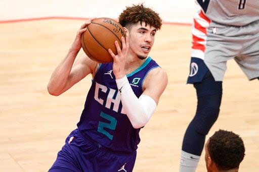 Charlotte Hornets guard LaMelo Ball (2) in action during the second half of an NBA basketball game against the Washington Wizards, Sunday, May 16, 2021, in Washington. (AP Photo/Nick Wass)