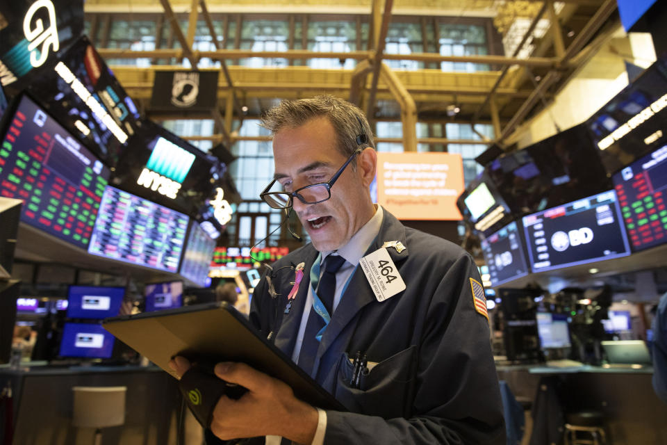 Trader Gregory Rowe monitors stock prices at the New York Stock Exchange, Monday, Sept. 16, 2019. Global stock markets sank Monday after crude prices surged following an attack on Saudi Arabia's biggest oil processing facility. (AP Photo/Mark Lennihan)