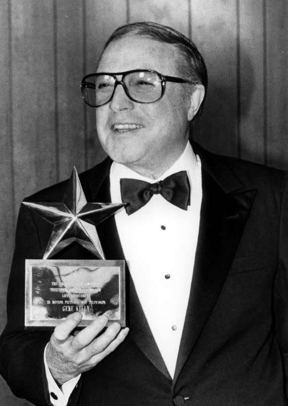 A beaming Gene Kelly holds his American Film Institute Life Achievement award at a photo session March 7, 1985. The legendary actor, singer, dancer and choreographer died February 2, 1996. File Photo by Glenn Waggner/UPI