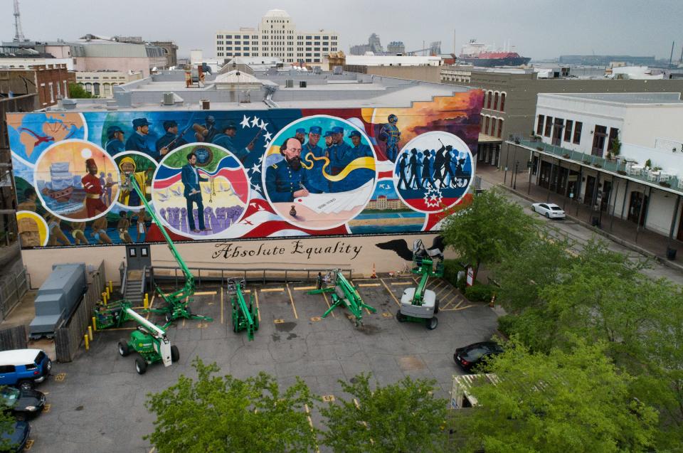 Artists work on final details on a 5000 sqft mural at the location of the former Osterman Building in Galveston on Saturday, April 10, 2021.