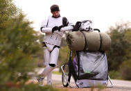 PERTH, AUSTRALIA - JULY 15: Stormtrooper Paul French is pictured on day 5 of his over 4,000 kilometre journey from Perth to Sydney checking his GPS approximately 20 kilometres from Mandurah on July 15, 2011 in Perth, Australia. French aims to walk 35-40 kilometres a day, 5 days a week, in full Stormtrooper costume until he reaches Sydney. French is walking to raise money for the Starlight Foundation - an organisation that aims to brighten the lives of ill and hostpitalised children in Australia. (Photo by Paul Kane/Getty Images)