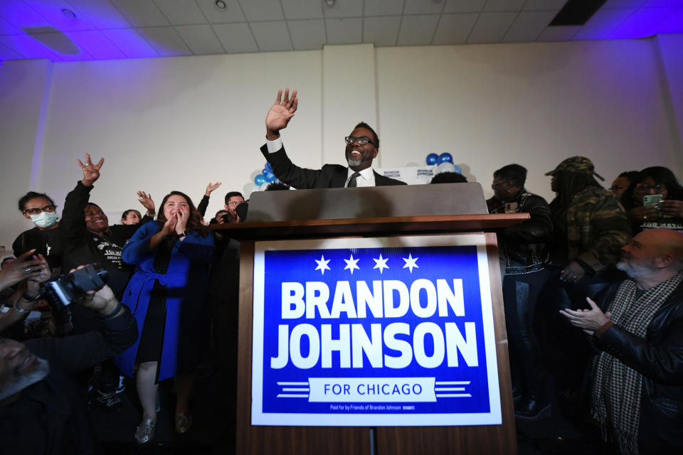  Brandon Johnson waves to supporters.
