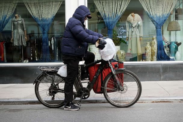 PHOTO: In this Nov. 15, 2022, file photo, a delivery person rides an electric bicycle through the streets of New York. (Spencer Platt/Getty Images, FILE)