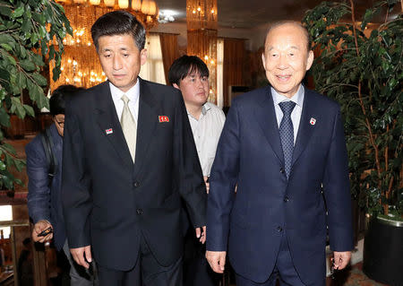 South Korea's delegation leader Park Kyung-seo, head of the Korean Red Cross, and North Korea's delegation leader Pak Yong-il, vice chairman of the Committee for the Peaceful Reunification of the Country, arrive for their meeting at a hotel on Mount Kumgang, North Korea, June 22, 2018. Yonhap via REUTERS ATTENTION EDITORS - THIS IMAGE HAS BEEN SUPPLIED BY A THIRD PARTY. SOUTH KOREA OUT. NO RESALES. NO ARCHIVE.