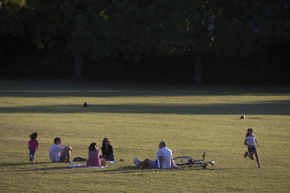 With the UK death toll reaching 38,489, a further 113 victims in the last 24hrs, and the government's pandemic lockdown still in effect, children race around other south Londoners practicing social distances in Ruskin Park, a public green space in the borough of Lambeth, on 31st May 2020, in London, England. (Photo by Richard Baker / In Pictures via Getty Images)