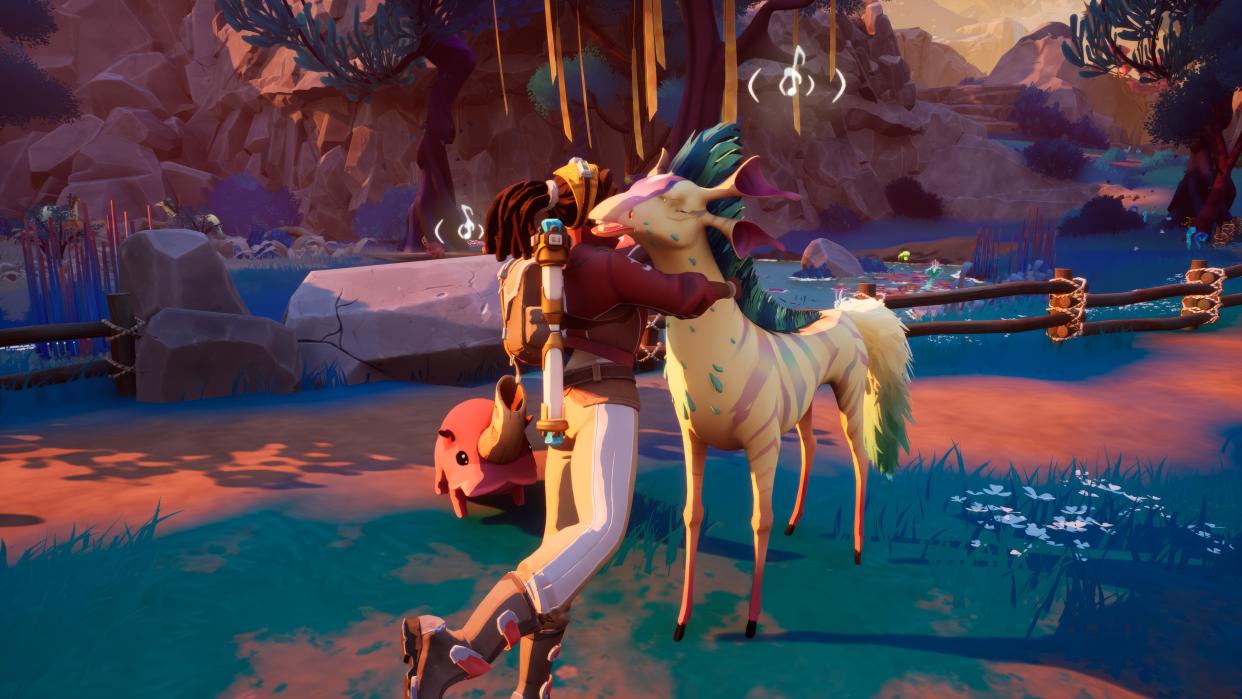  Creatures of Ava - a human player hugs an alien deer creature in a forest. 