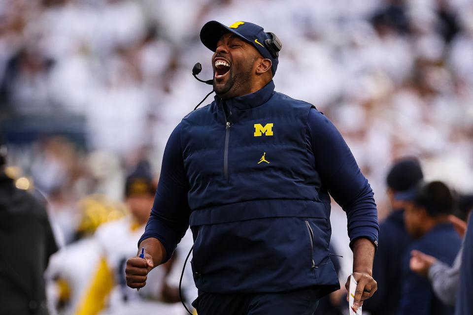 Acting head coach Sherrone Moore of the Michigan Wolverines celebrates after an offensive touchdown against the Penn State Nittany Lions during the second half at Beaver Stadium on November 11, 2023 in State College, Pennsylvania.