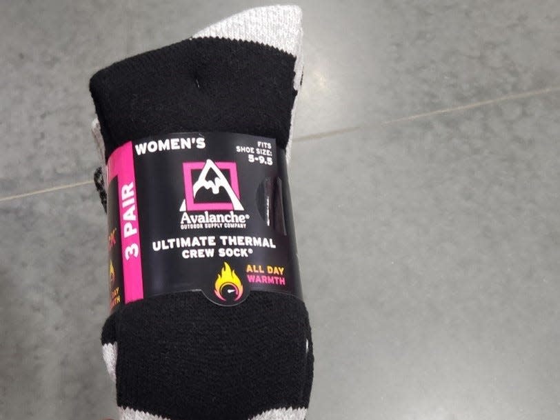 pack of black-and-white thermal socks on the floor at Costco