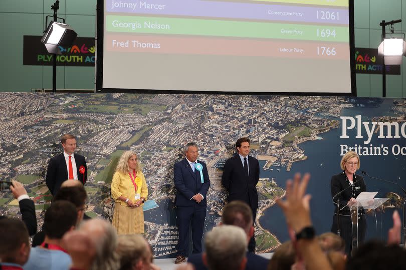 Fred Thomas is announced the new MP for Moor View with 17665 (photo taken millisecond before last number shown)