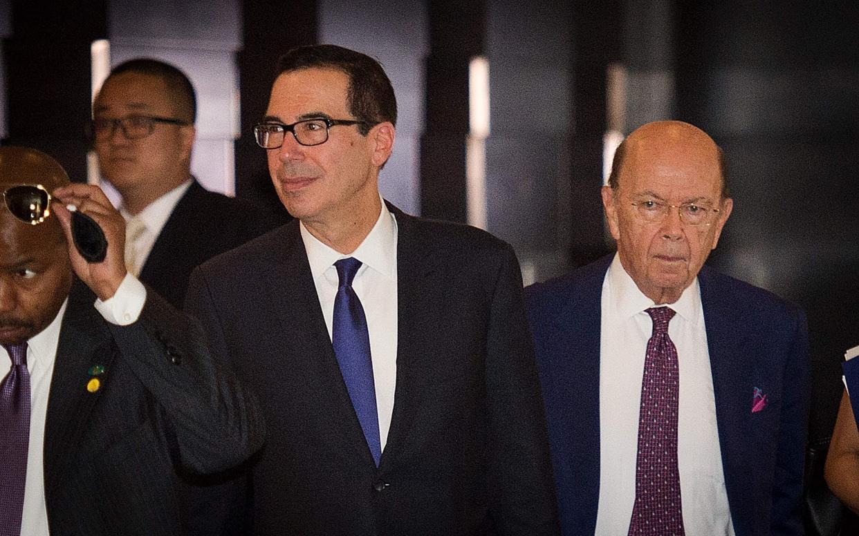 US Treasury Secretary Steven Mnuchin (L) and US Commerce Secretary Wilbur Ross (R) in Beijing - AFP