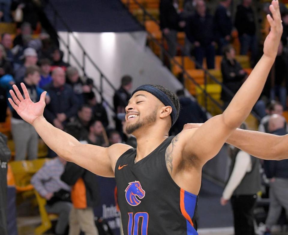 Boise State guard Marcus Shaver Jr. celebrates after sinking the game-winning 3-pointer in the Broncos’ 62-59 win over Utah State at Dee Glen Smith Spectrum in Logan, Utah.