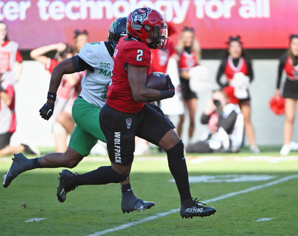 Oct 7, 2023; Raleigh, North Carolina, USA; North Carolina State Wolfpack running back Michael Allen (2) runs for a touchdown during the second half against the Marshall Thundering Herd at Carter-Finley Stadium. Mandatory Credit: Rob Kinnan-USA TODAY Sports