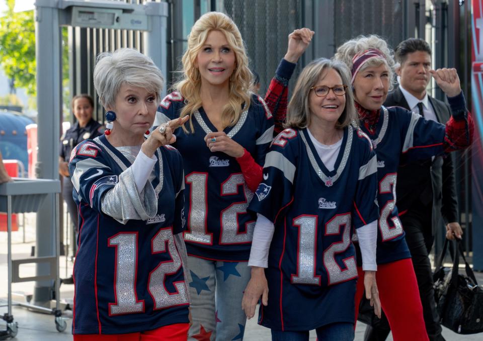 In "80 for Brady," Rita Moreno, from left, Jane Fonda, Sally Field and Lily Tomlin star in the sports comedy based on the true story of four best friends who take a wild trip to the 2017 Super Bowl LI to see their quarterback hero, Tom Brady, play.