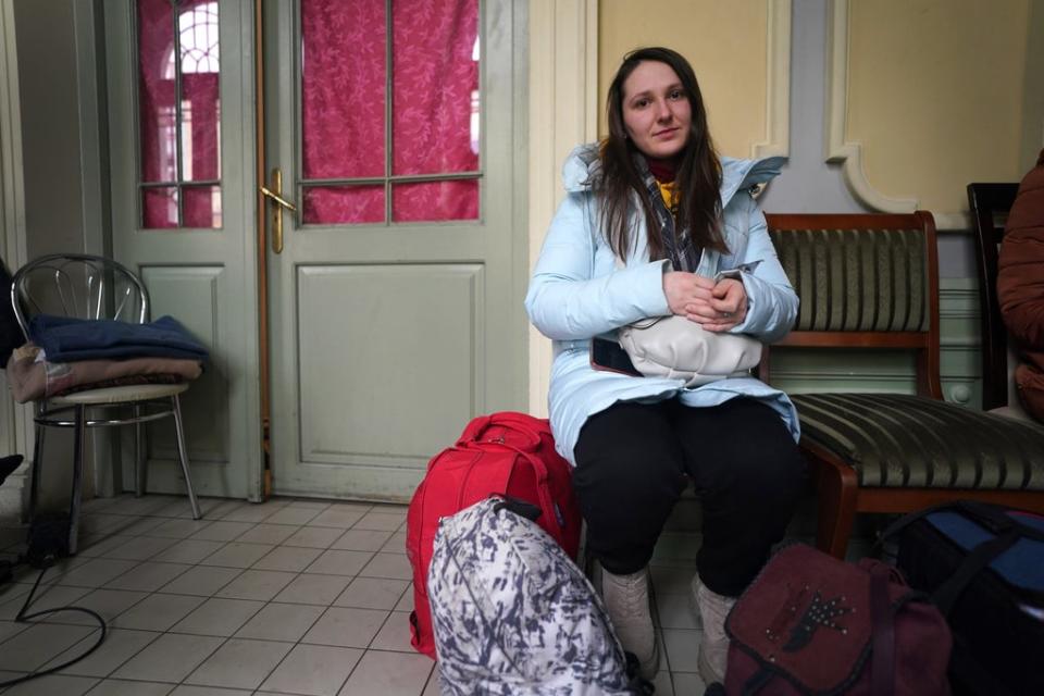 Yana Syniavina waits with her luggage at Przemysl train station in Poland after leaving Ukraine. (Victoria Jones/PA) (PA Wire)