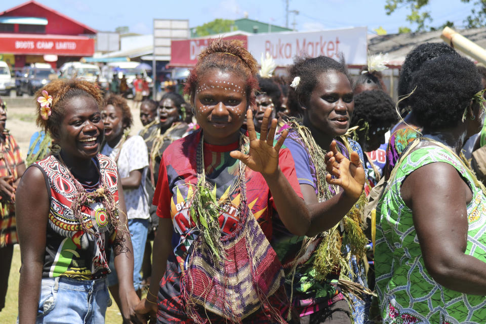 In this Nov. 30, 2019, photo released by Bougainville Referendum Commission (BRC), voters from Selau gather at Buka Market in Bougainville, Papua New Guinea. All across the Pacific region of Bougainville, people have been voting in a historic referendum to decide if they want to become the world’s newest nation by gaining independence from Papua New Guinea. (Jeremy Miller/BRC via AP)