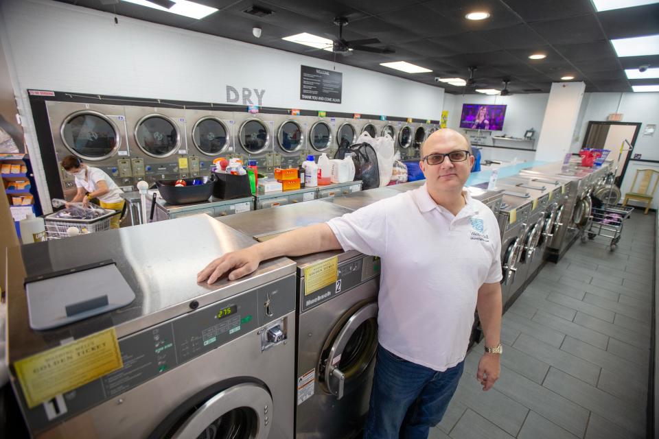 Mark Csordos, owner of Washing Well, stands in his new business in Aberdeen Twp., NJ Tuesday May 9, 2023. Csordos started a successful business, wrote a book about entrepreneurship and was featured in the New York Times all before the age of 30. But he found himself bouncing among retail jobs and fighting depression. Now 52, he has purchased the laundromat in a move that he hopes will allow him to find contentment once again.