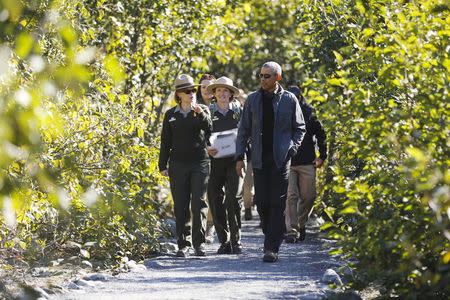 U.S. President Barack Obama hikes with National Park Service staffs to the Exit Glacier at Kenai Fjords National Park in Seward, Alaska, September 1, 2015. REUTERS/Jonathan Ernstâ€¨