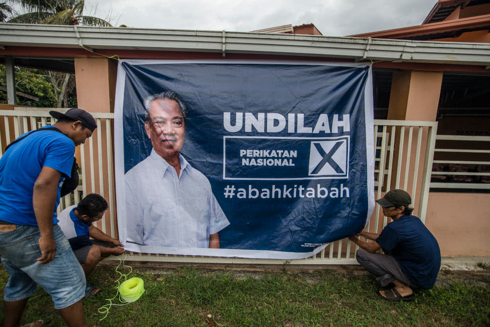 An election poster of Perikatan Nasional chairman Tan Sri Muhyiddin Yassin is seen in Pintasan, Kota Belud, Sabah, September 16, 2020. — Picture by Firdaus Latif