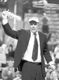 Maryland coach Gary Williams waves the net after winning the ACC Tournament. AP Photo.