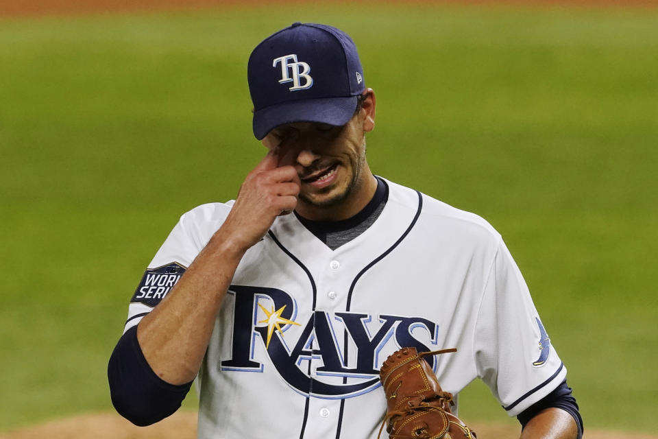 Tampa Bay Rays starting pitcher Charlie Morton reacts after giving up two runs against the Los Angeles Dodgers during the third inning in Game 3 of the baseball World Series Friday, Oct. 23, 2020, in Arlington, Texas. (AP Photo/Tony Gutierrez)