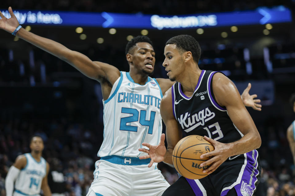 Sacramento Kings forward Keegan Murray (13) looks to drive against Charlotte Hornets forward Brandon Miller during the second half of an NBA basketball game in Charlotte, N.C., Wednesday, Jan. 10, 2024. (AP Photo/Nell Redmond)